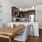 a kitchen with a table and chairs