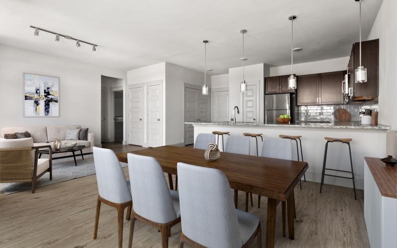 a kitchen with a dining table and chairs