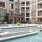 a pool in a courtyard between buildings