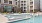 a pool in a courtyard between buildings