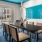 a dining room with a table and chairs