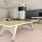 a ping pong table in a room with a tv and speakers