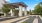 a building with pillars and a fence