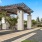 a building with pillars and a fence