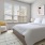 a bedroom with a bed and a chair
