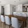 a kitchen with a dining table and chairs