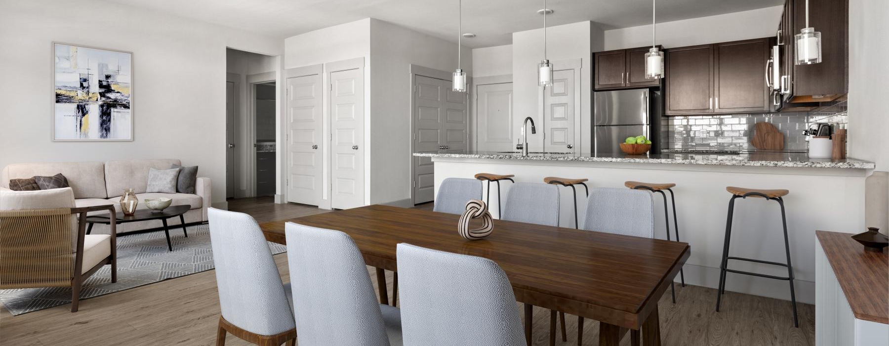 a kitchen with a dining table and chairs