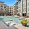 a pool in a courtyard with buildings around it